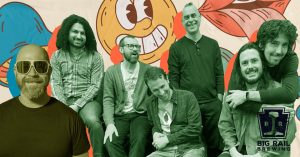 Group of seven men posing together in front of a colorful cartoon mural; Big Rail Brewing logo bottom right.