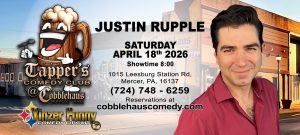Poster advertising a live comedy show: Justin Rupple on Saturday, April 18, 2026 at Cobblehaus Comedy Club, Mercer, PA (8:00 showtime). A smiling man in a red shirt stands beside a cartoon beer mug mascot.